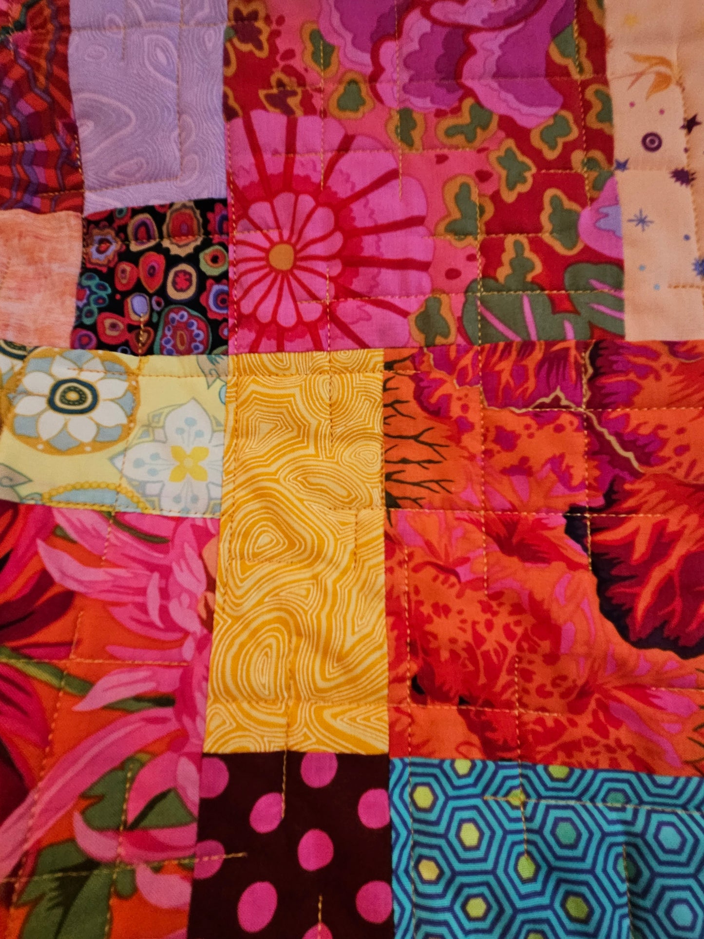 Photo showing Tula fabrics and Kaffe reds
