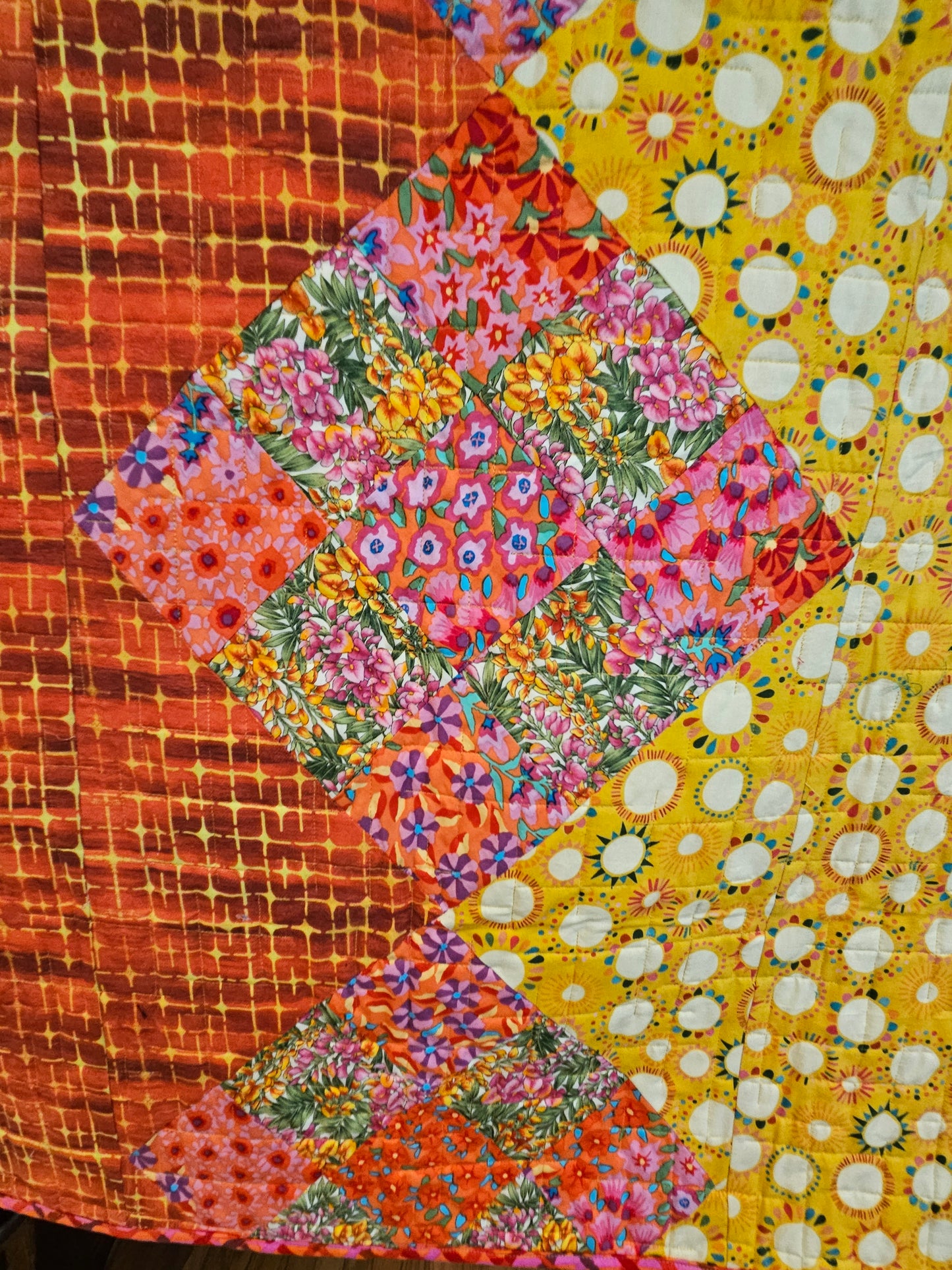 Close of the Kaffe Fassett nine patches. They're blendy.