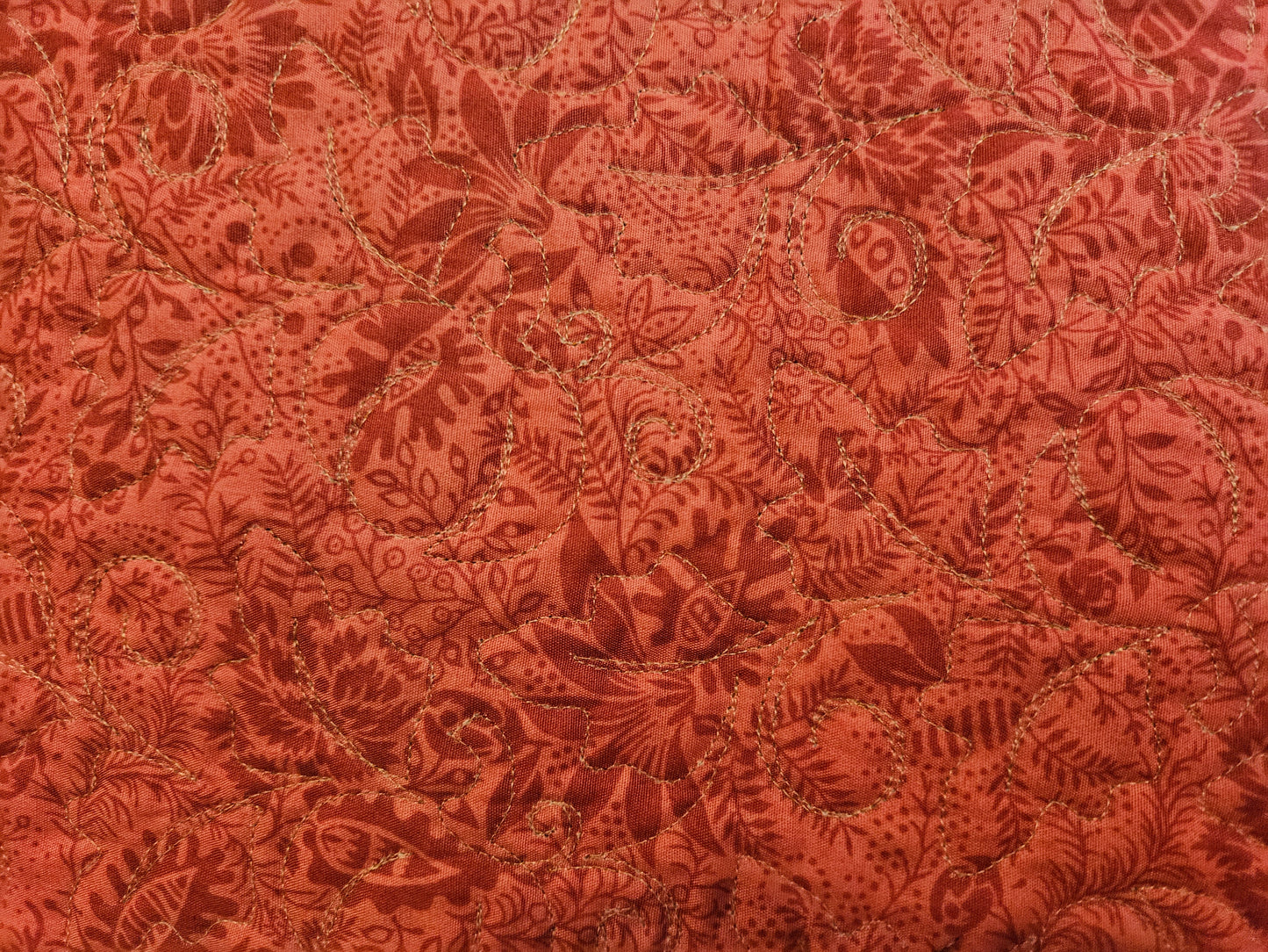 The quilting is hard to see and it shows best on the red.