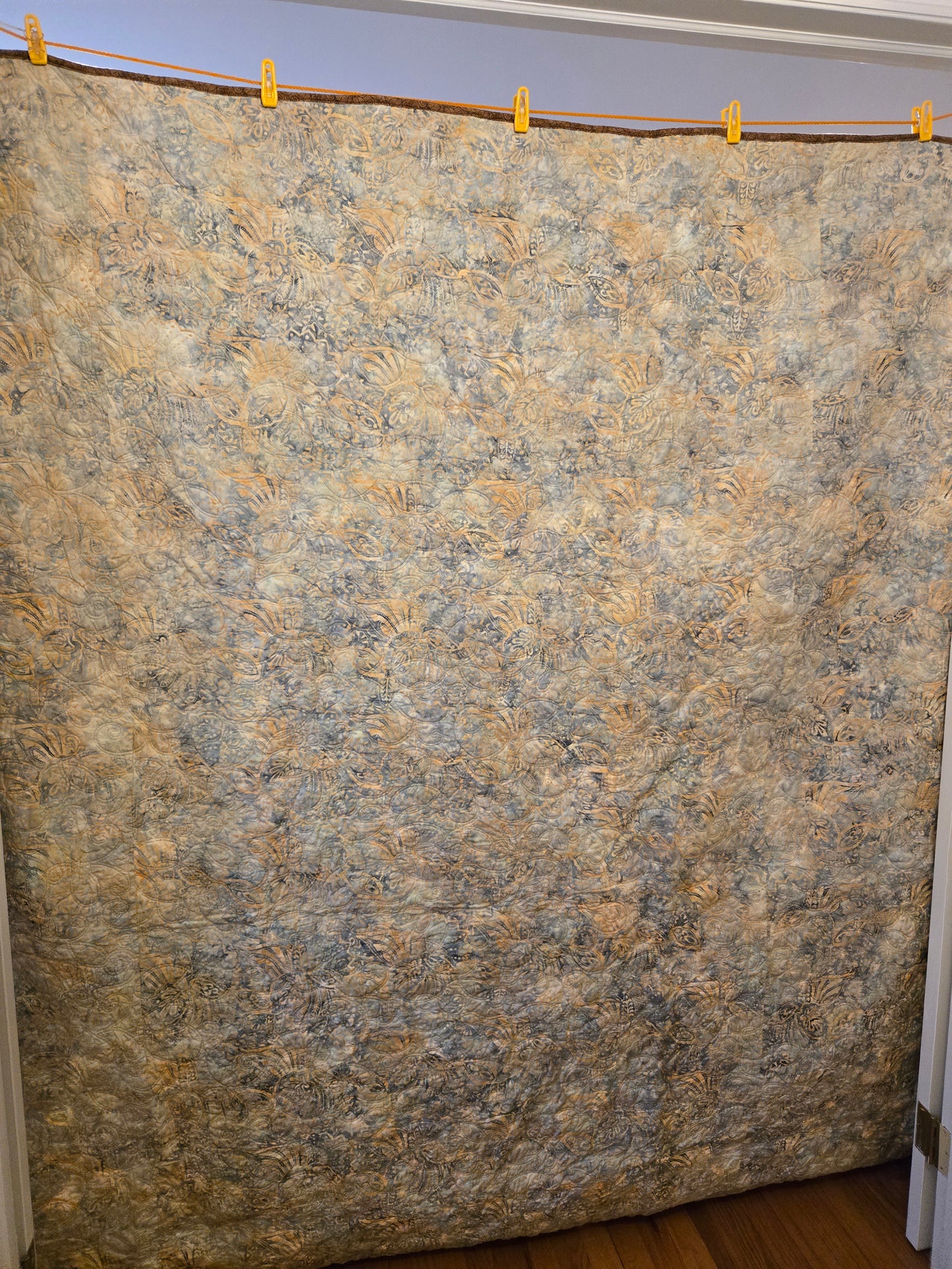 Phot of quilt back. Pieced of one batik fabrc.
