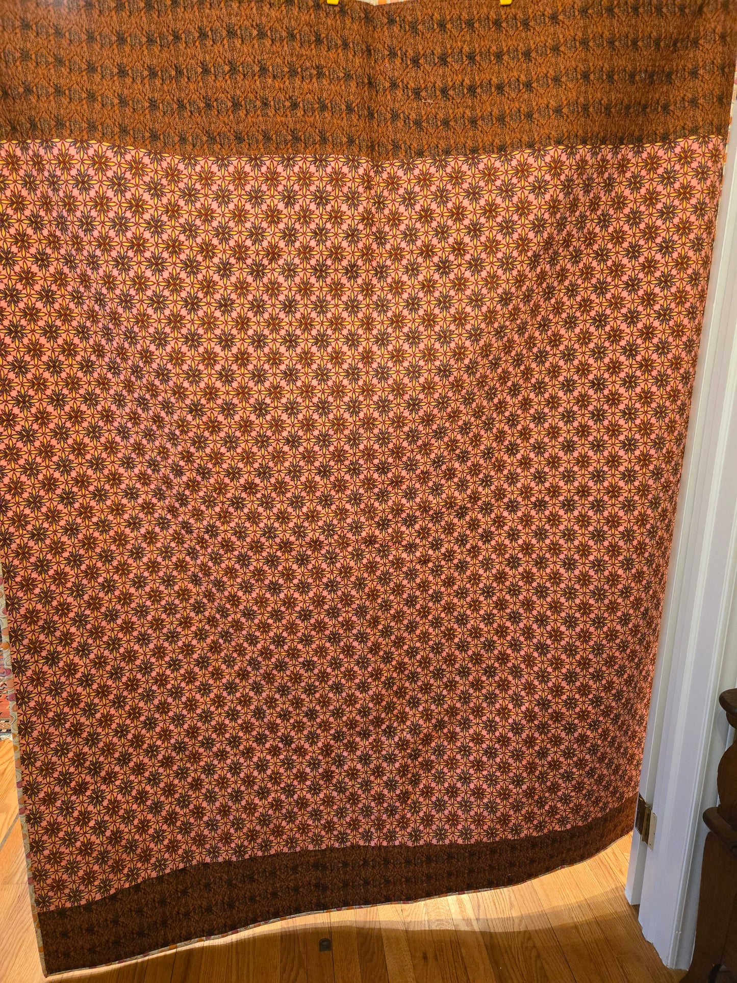 Pink/red back with brownish/reddish fabric.