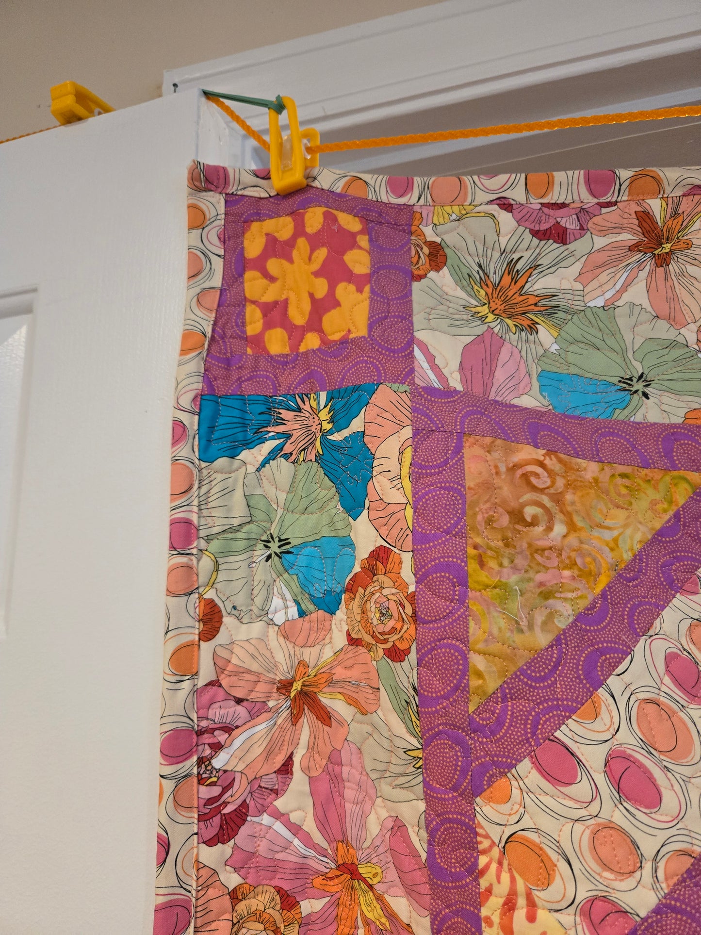 Corner block of squiggle and floral border.