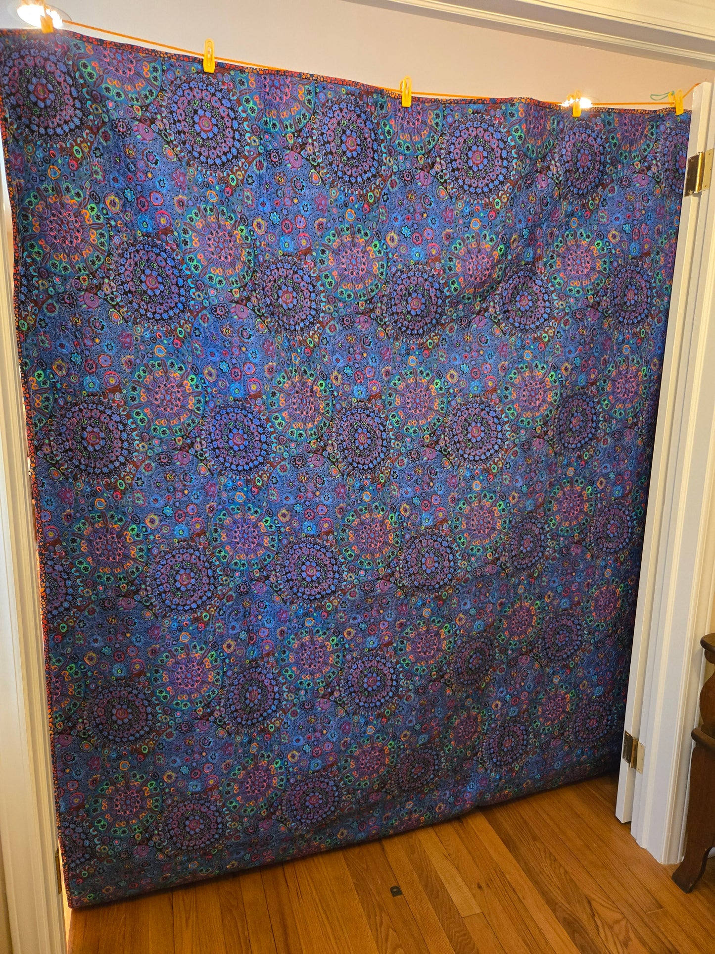 The back is a single piece of Kaffe Fassett wide blue millefiore. It's 300 count Santeen cotton.