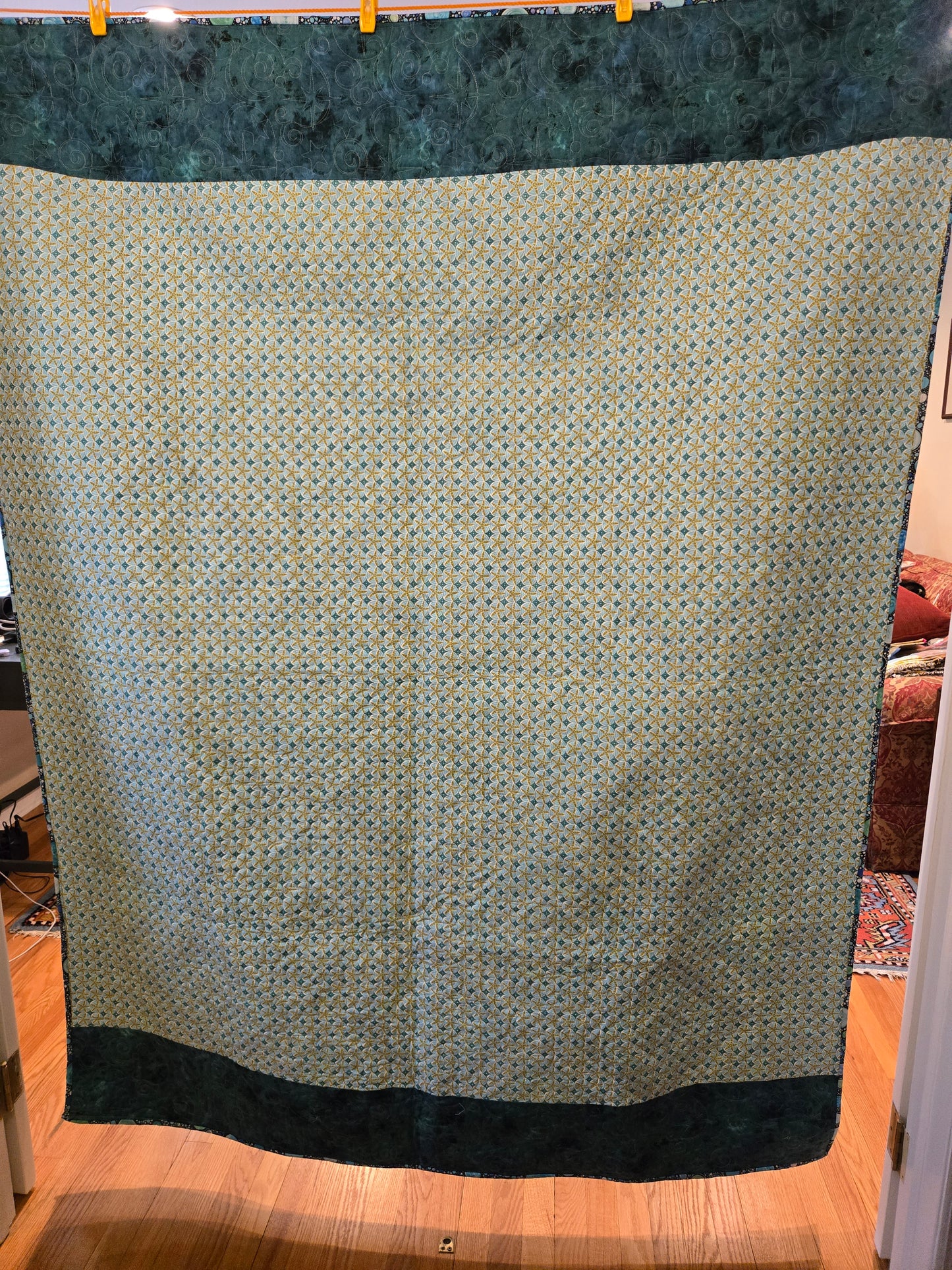 Back is a blue starfish pattern. The top and bottom is trimmed in a aqua blue.
