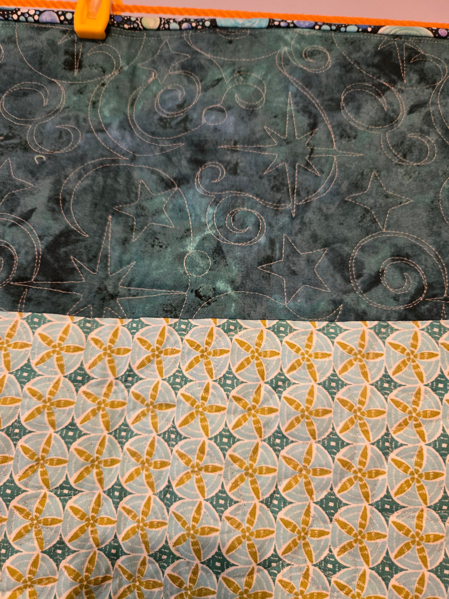 The quilting shows well in the solid color.