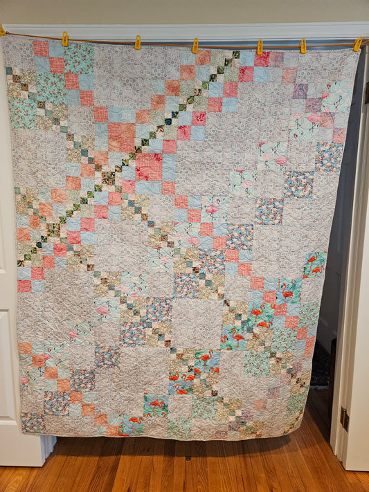 Photo showing the entire front of the blue flamingo quilt.  