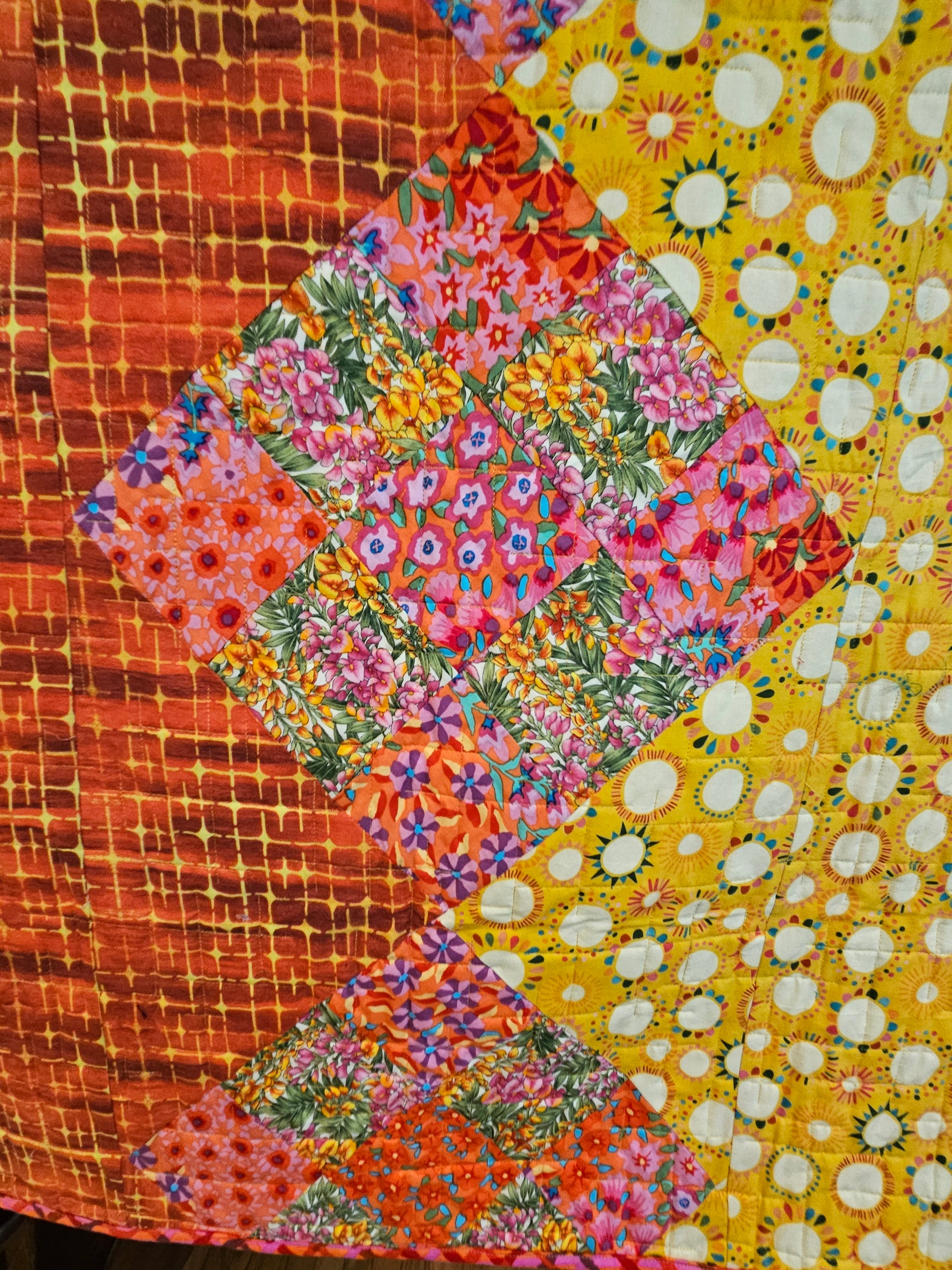 Close of the Kaffe Fassett nine patches.  They're blendy.