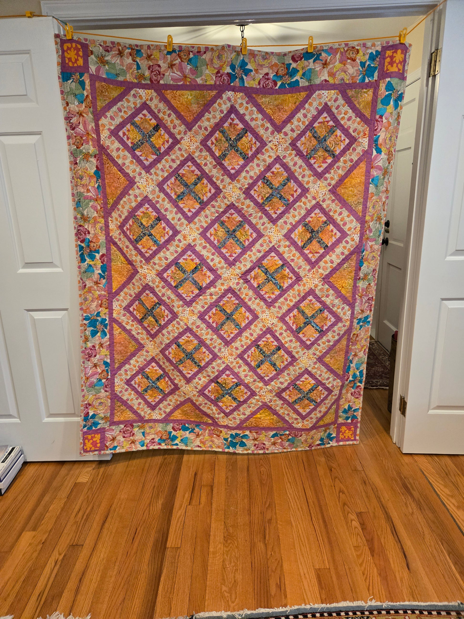 Picture of entire quilt.  Blocks in the middle are hen and chicks.