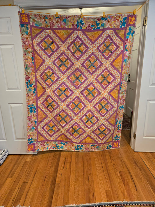 Picture of entire quilt.  Blocks in the middle are hen and chicks.