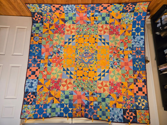 Photo of full quilt.  Dragon in the center.