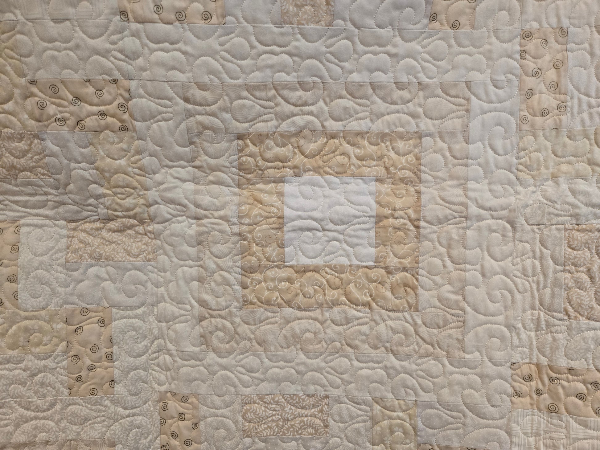 This is a close up of one of the square in square blocks. You can see the quilting.